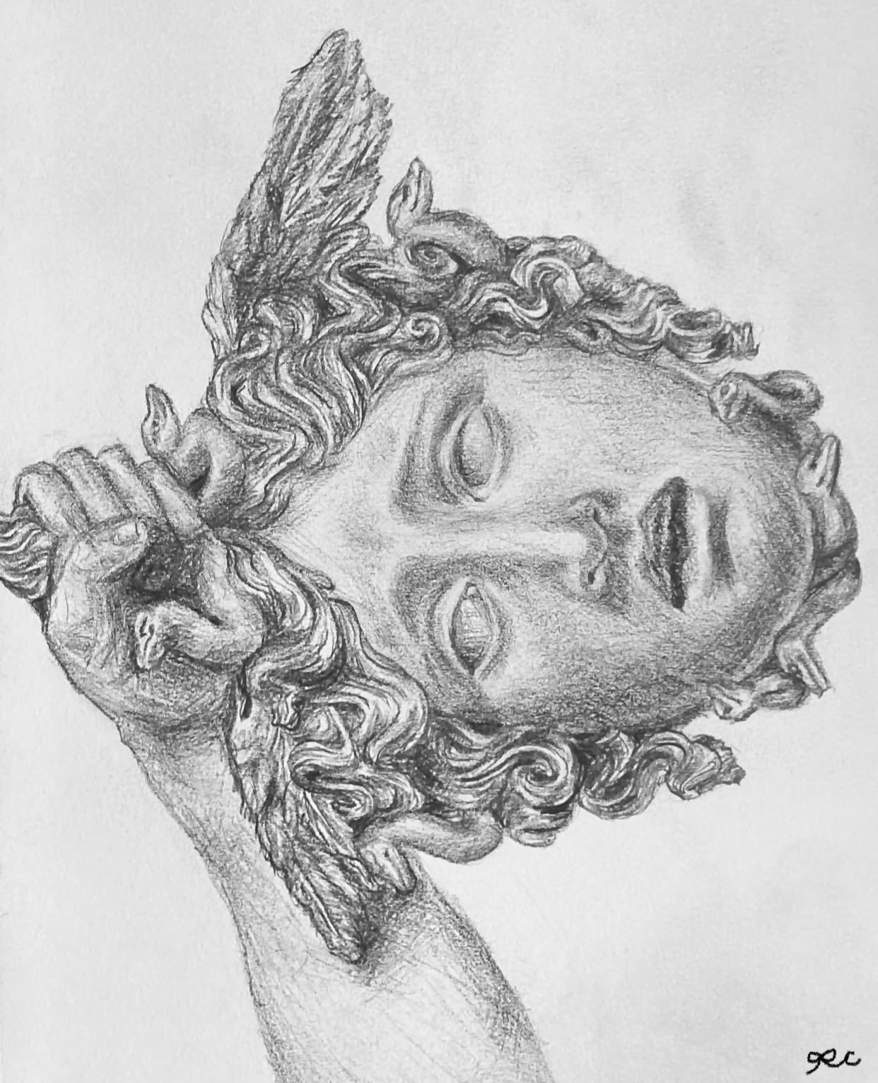 Graphite study of a classical sculpted head on white paper.