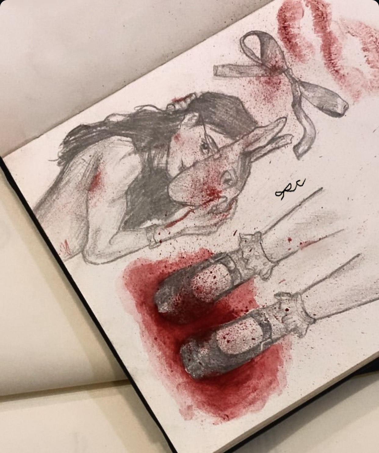 Watercolor and graphite studies in red, gray, and black across overlapping pages.