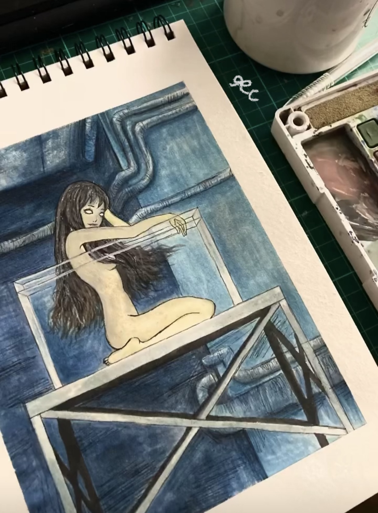 Sketchbook study of a framed painting beside drawing materials.