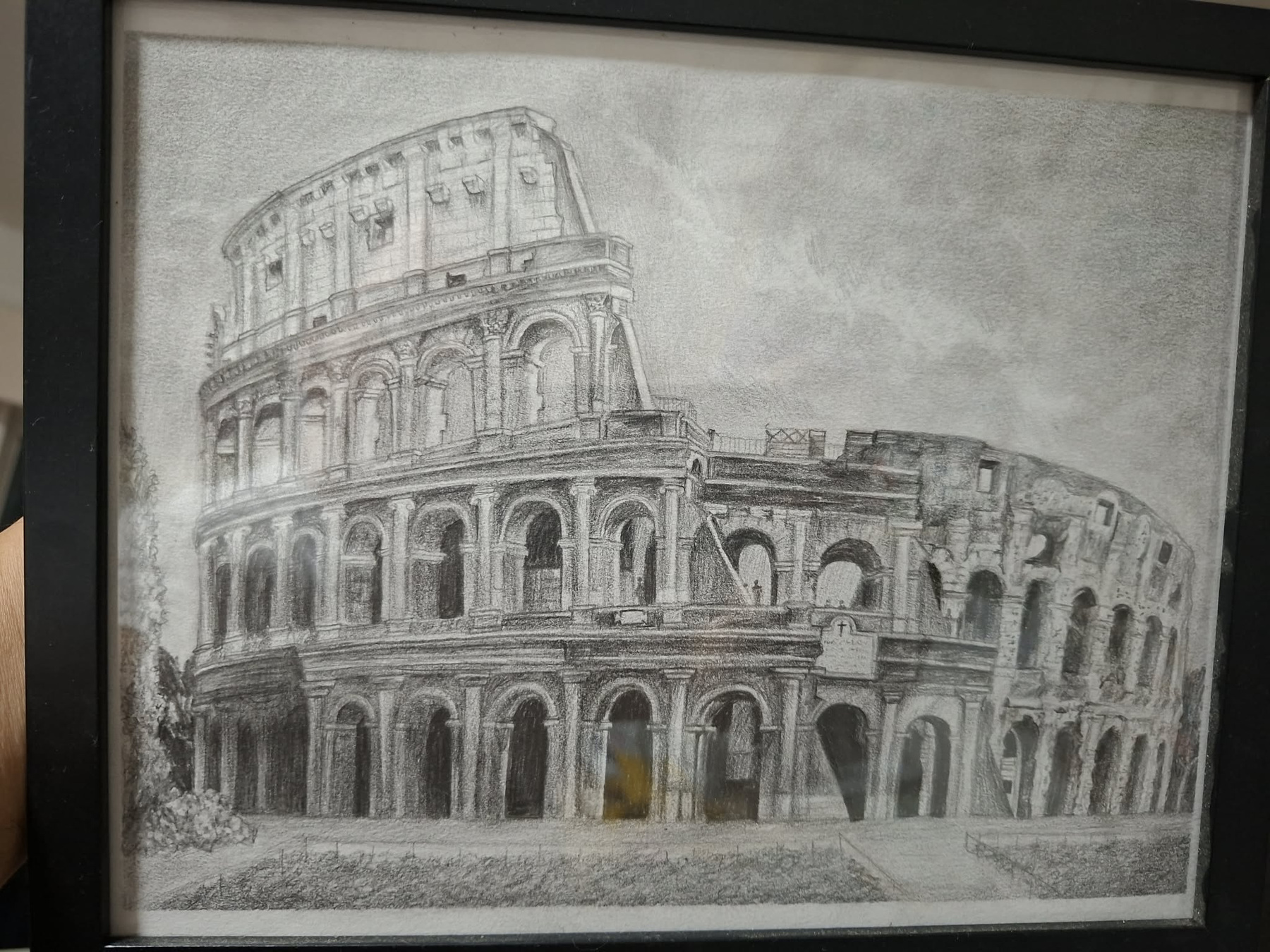 Framed graphite architectural study of the Colosseum viewed from an angle.